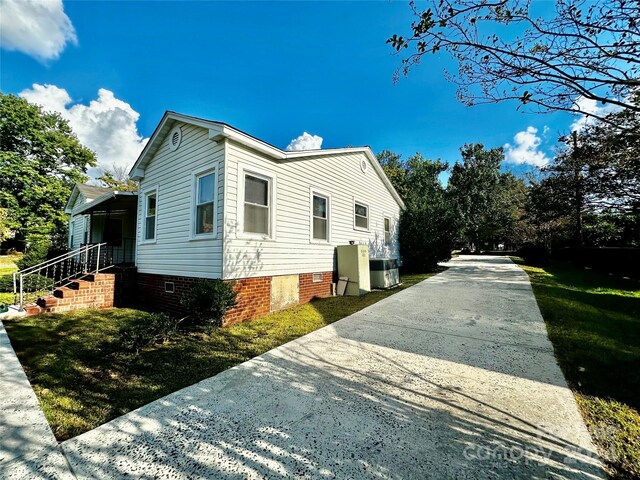 view of home's exterior with central air condition unit