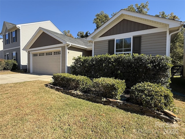 view of front facade with a front lawn and a garage