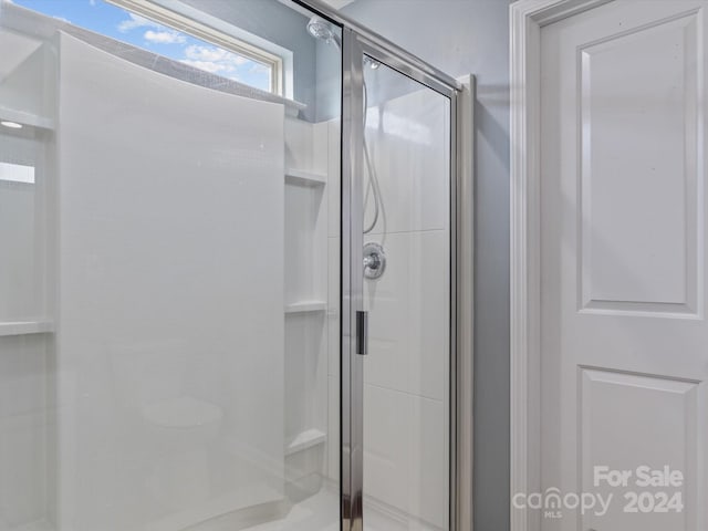 bathroom featuring walk in shower