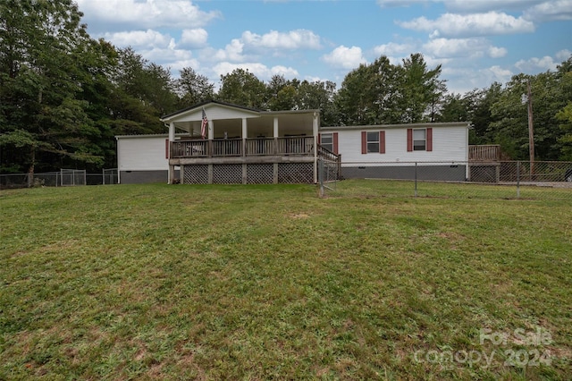 exterior space featuring a front yard and a deck