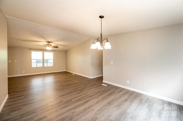 unfurnished room featuring ceiling fan with notable chandelier and hardwood / wood-style floors