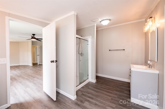 bathroom with vanity, hardwood / wood-style floors, ceiling fan, and a shower with door