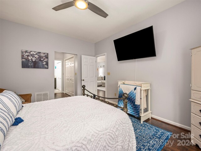 bedroom featuring ceiling fan and dark wood-type flooring