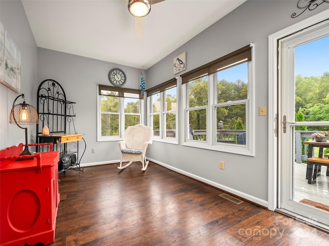 sitting room featuring a wealth of natural light, ceiling fan, and dark wood-type flooring