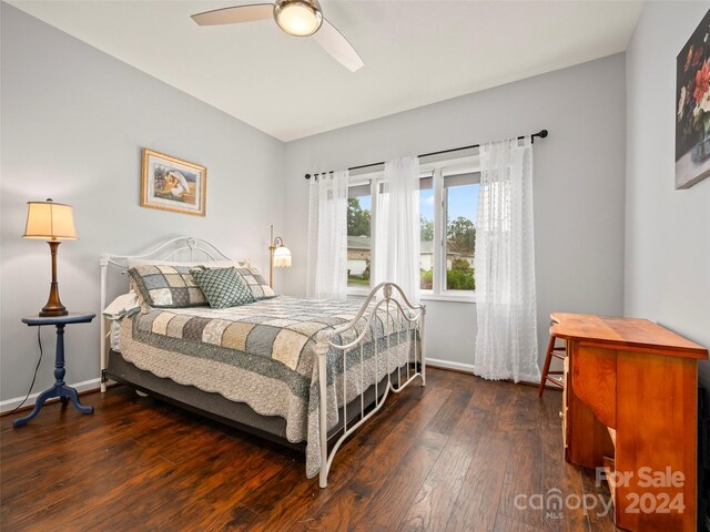 bedroom featuring ceiling fan and dark hardwood / wood-style flooring