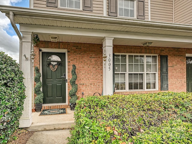 entrance to property with covered porch