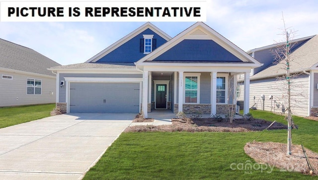 craftsman house with a garage, covered porch, and a front yard