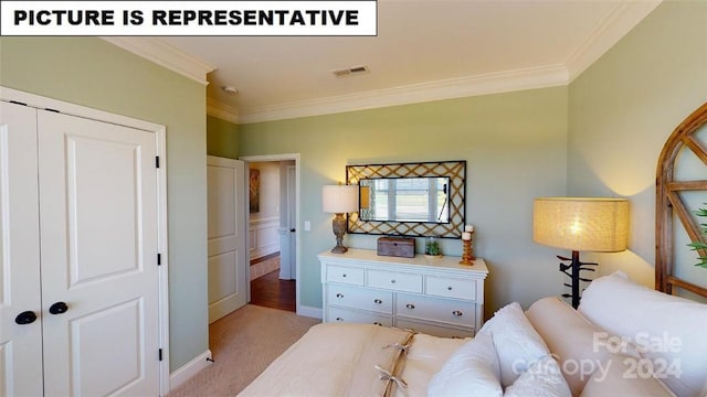 carpeted bedroom featuring a closet and ornamental molding