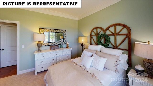 bedroom featuring light colored carpet and ornamental molding