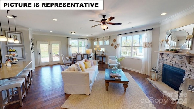 living room featuring a stone fireplace, ceiling fan, plenty of natural light, and ornamental molding