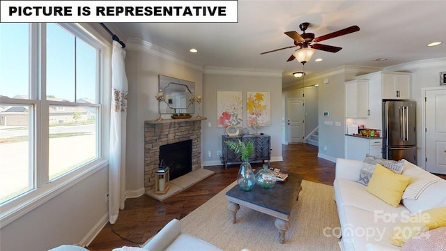 living room with a fireplace, a wealth of natural light, and ornamental molding