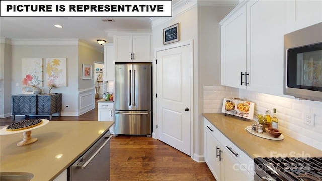 kitchen with tasteful backsplash, ornamental molding, stainless steel appliances, dark hardwood / wood-style floors, and white cabinetry