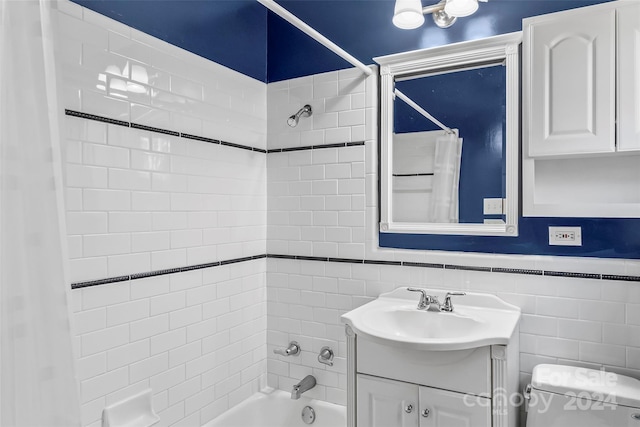 full bathroom with vanity, shower / bath combination with curtain, tile walls, and toilet