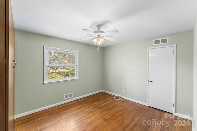 unfurnished bedroom featuring ceiling fan and hardwood / wood-style flooring