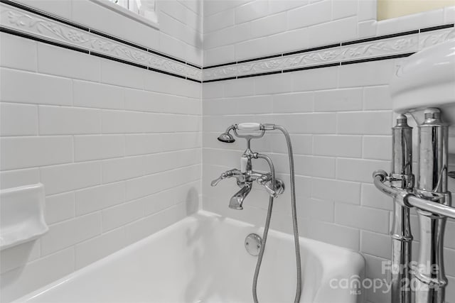 bathroom with a tub to relax in