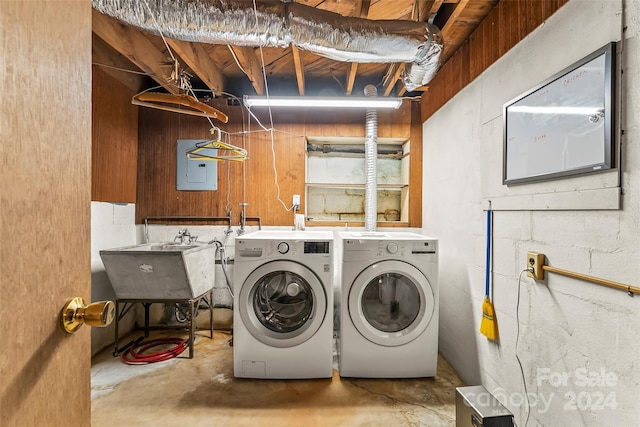 laundry area with separate washer and dryer, sink, and electric panel