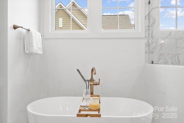 bathroom with a tub