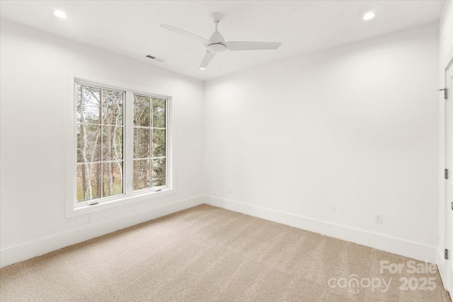 carpeted empty room with ceiling fan