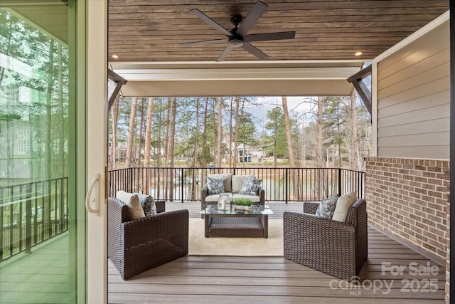 unfurnished sunroom with wood ceiling and ceiling fan