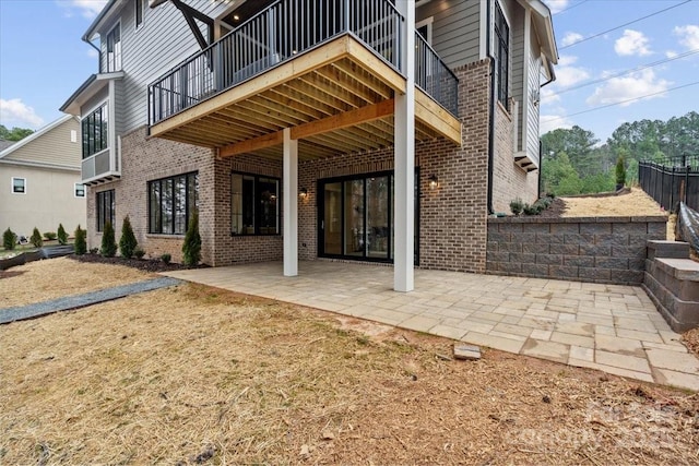 back of house with a patio area