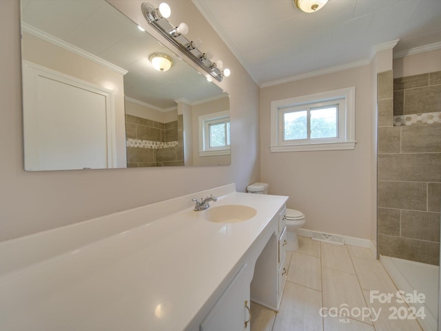 bathroom featuring ornamental molding, vanity, toilet, and tile patterned floors