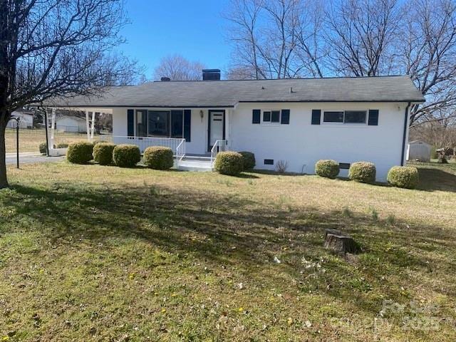 ranch-style home with a chimney, a porch, crawl space, a front lawn, and a carport