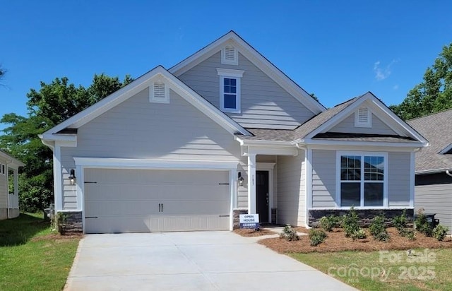 craftsman-style house featuring a garage