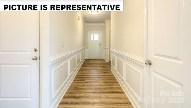 interior space with crown molding and hardwood / wood-style floors