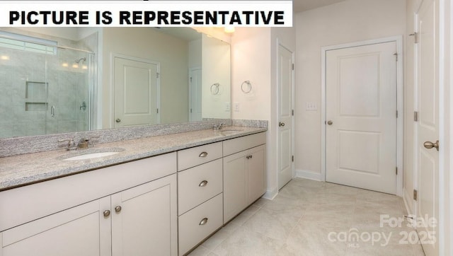 bathroom featuring vanity, tile patterned floors, and a shower with door