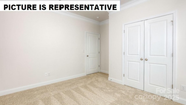 unfurnished bedroom featuring ornamental molding, light carpet, and a closet