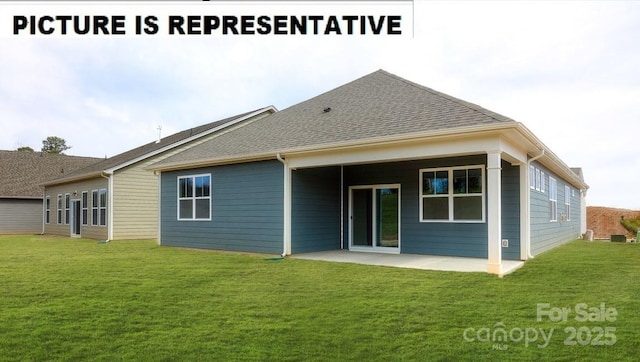 rear view of property featuring a yard and a patio