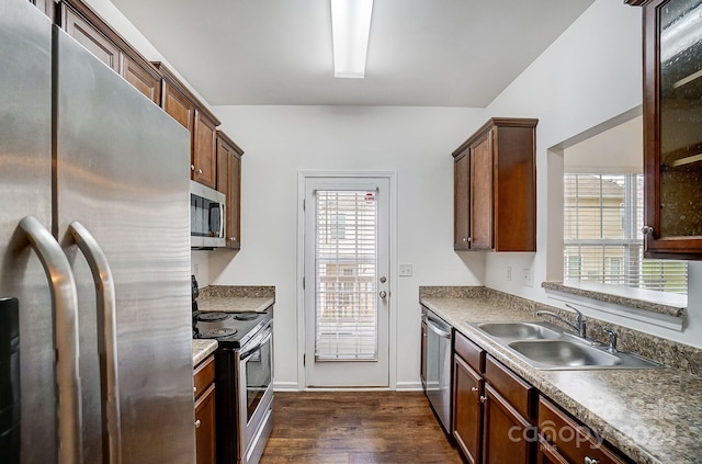 kitchen with sink, dark wood-type flooring, and stainless steel appliances