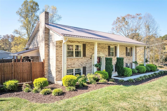 bi-level home with a front lawn