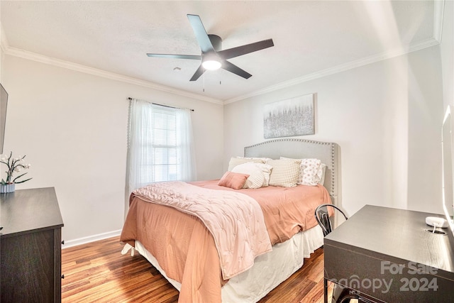 bedroom with ornamental molding, hardwood / wood-style floors, and ceiling fan