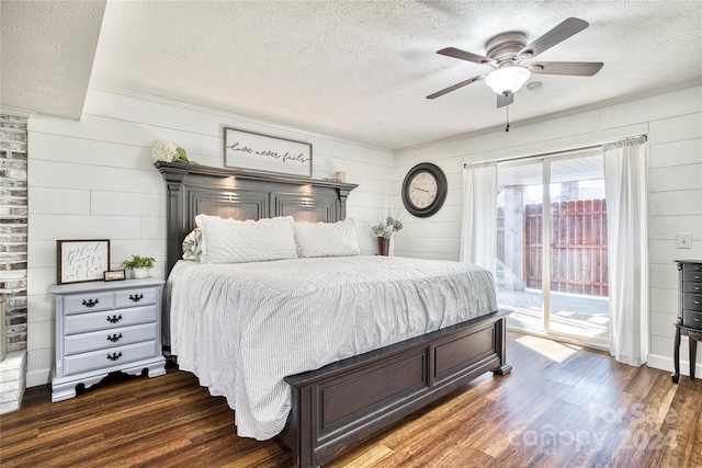 bedroom with dark wood-type flooring, ceiling fan, access to outside, and a textured ceiling