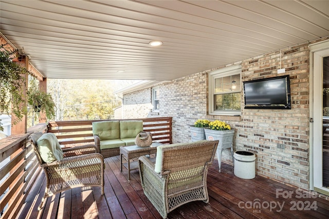 wooden deck with an outdoor hangout area