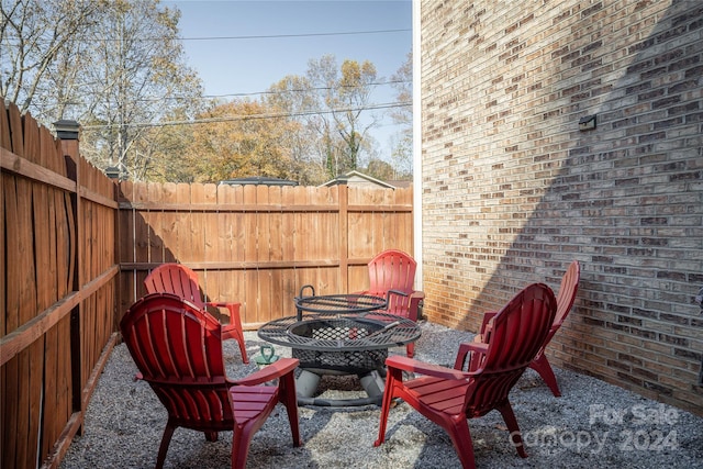 view of patio / terrace with a fire pit