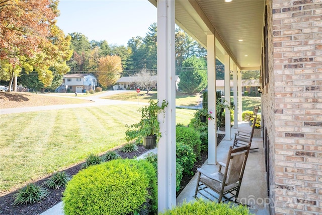 view of yard featuring covered porch