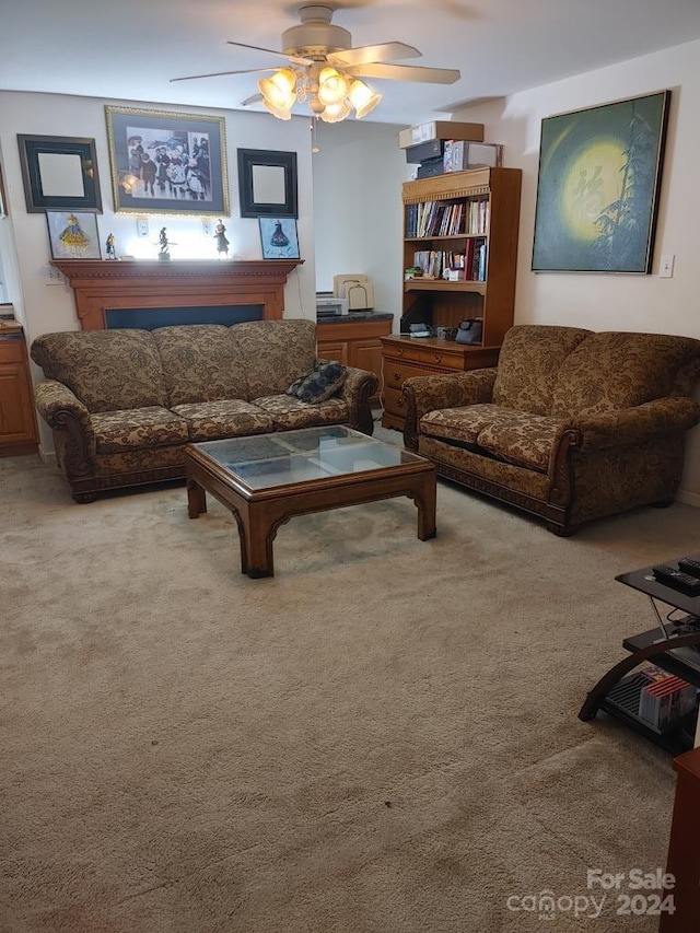 carpeted living room with ceiling fan