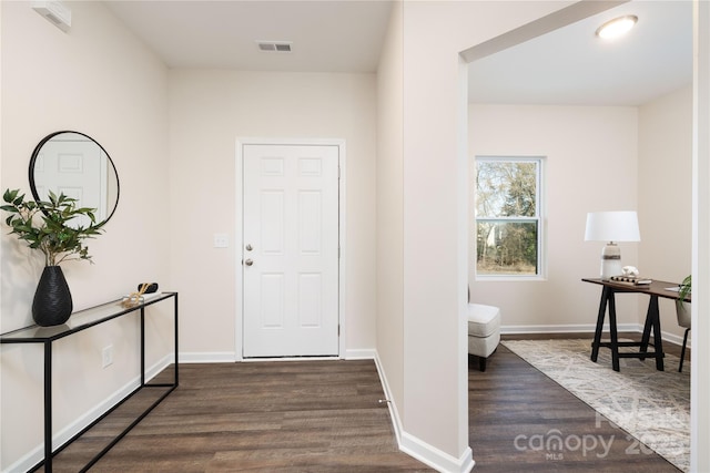 entrance foyer featuring dark hardwood / wood-style floors