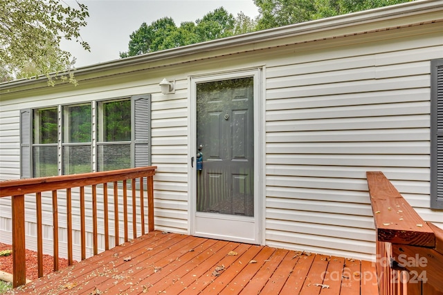 property entrance with a wooden deck