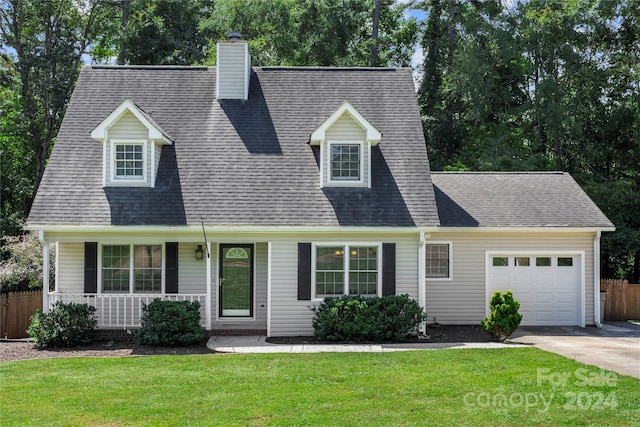 cape cod house featuring a garage, a porch, and a front lawn