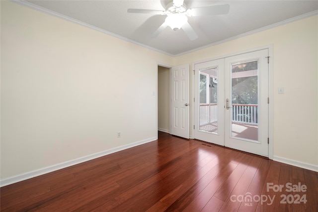 empty room with ornamental molding, ceiling fan, french doors, and dark hardwood / wood-style flooring