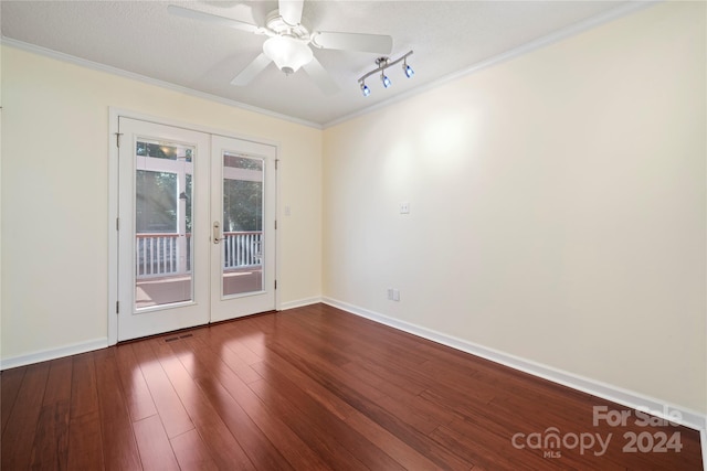 empty room featuring french doors, crown molding, hardwood / wood-style floors, and ceiling fan