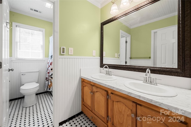 bathroom featuring ornamental molding, vanity, and toilet