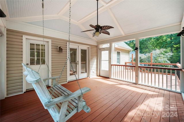 wooden deck featuring ceiling fan and french doors