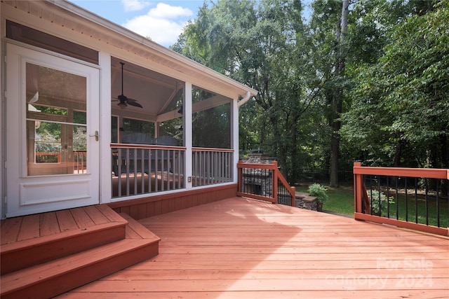 wooden terrace featuring a sunroom