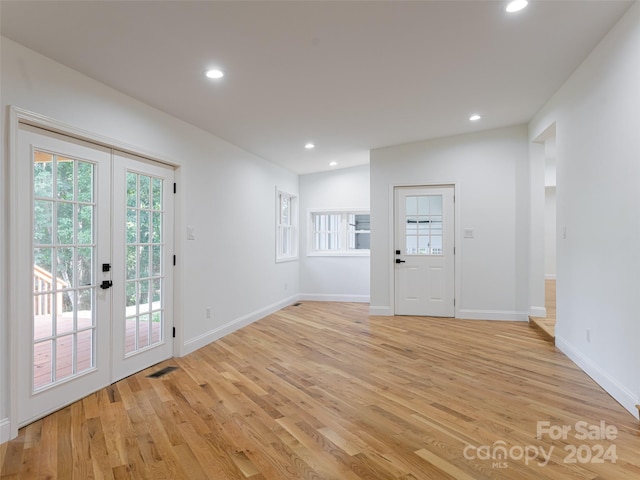 interior space featuring french doors and light hardwood / wood-style flooring