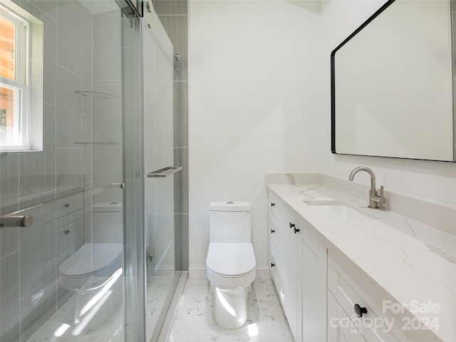 bathroom with vanity, toilet, and an enclosed shower