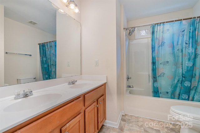 full bathroom featuring toilet, vanity, and shower / bath combo with shower curtain